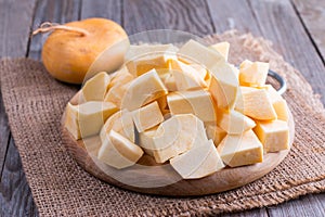 Cubes turnips on a chopping board