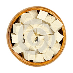 Cubes of white tofu, diced bean curd made of soy milk, in a bowl