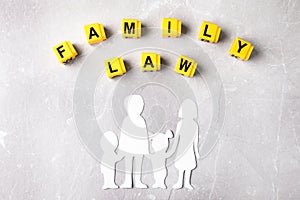 Cubes with words Family law and figure in shape of people on background, flat lay