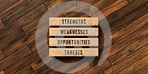 Cubes with the words STRENGTH, WEAKNESSES, OPPORTUNITIES and THREATS - 3D rendered illustration