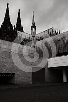 Cubist architecture of the Roman-Germanic Museum in front of Cologne Cathedral in Cologne, Germany