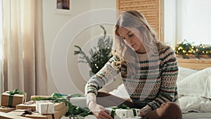 Cucasian woman packing Christmas presents