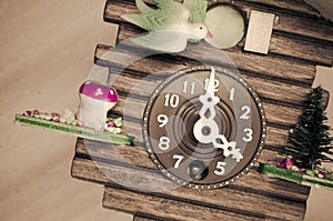 cuckoo wall clock, three o'clock