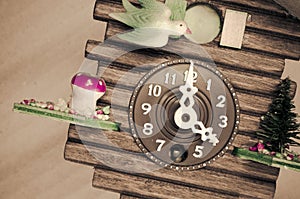 cuckoo wall clock, three o'clock