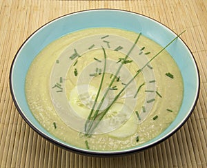 Cucumber and avocado soup on bamboo placemat