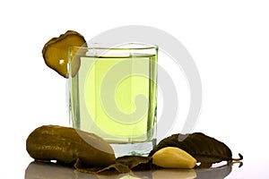 Cucumber brine in the glass and salt vegetables