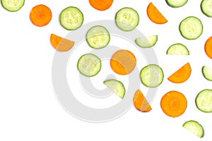 Cucumber and carrot slices isolated on white