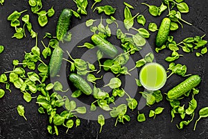 Cucumber, celeriac. Vegetables for greeny organic smoothy for sport diet on dark background top view mockup