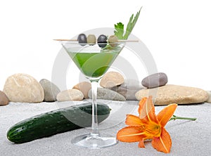 Cucumber cocktail in a environment of sand and pebble stones