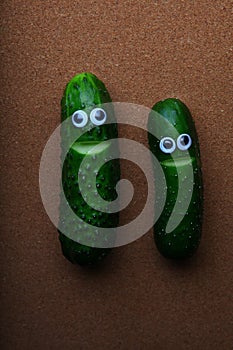 Cucumber face wooden background studio photo
