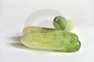 Cucumber, green vegetables on a white background, fresh, crispy, sweet taste. photo