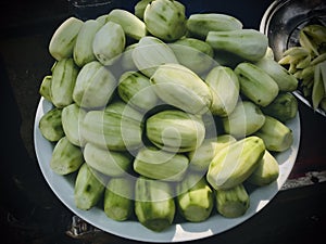 Cucumber, peeled cucumbers, a hawker removed bark for sale