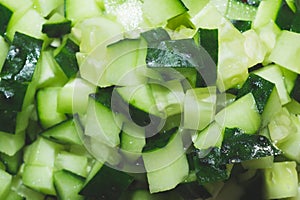 Cucumber pieces macro. Salad ingredient. Vegetable background