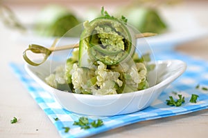 Cucumber roll on salad