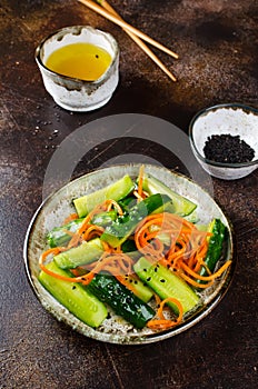 Cucumber salad with carrots and sesame seeds