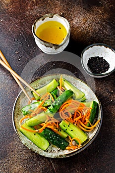 Cucumber salad with carrots and sesame seeds