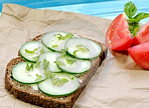 Cucumber sandwich with tomato and mint and basil photo