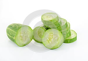 Cucumber and slices isolated over white background.