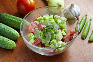 Cucumber and tomato salad in a bowl, vegetables