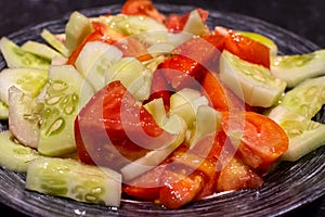Cucumber and tomato salad with olive oil