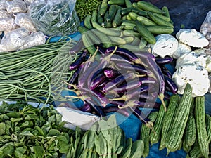 cucumbers, eggplants, bitter melons, spinach, long beans, and some other vegetables sold in the Indonesian traditional market.