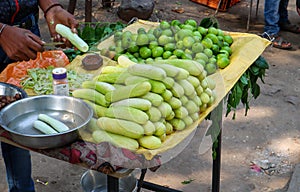 Cucumbers and indian jujube for sale at a roadside stall