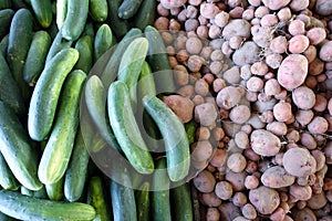 Cucumbers and Red Potatoes for Sale at a Farmers Market