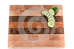 Cucumbers Slices On Wood Butcher Block Cutting Board 