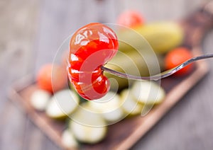 Cucumbers and tomatoes salty table