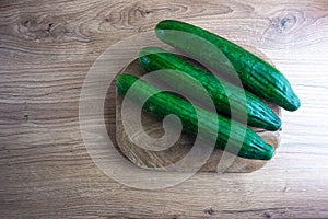 Cucumbers on a wooden background