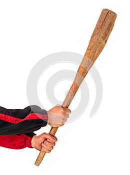 Cudgel hold by man hands in track suit