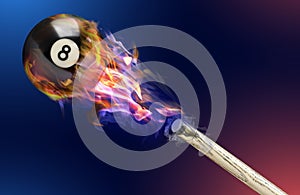 Cue and billiard ball with number 8 in fire flying on color background