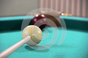 Cue, two billiard balls on a green cloth table, cue ball and white ball. framing, Russian Billiards