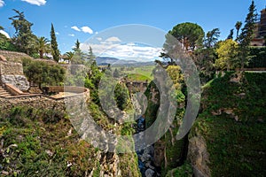 Cuenca Gardens and Puente Viejo Bridge at El Tajo Canyon - Ronda, Andalusia, Spain photo