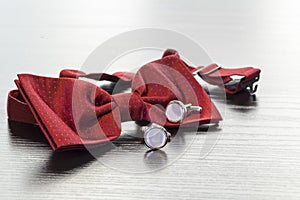 Cuff links and red bow tie