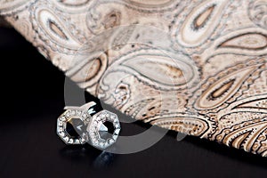 Cufflinks on a black background