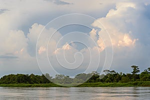 Cuiaba river with landscape and storm clouds photo