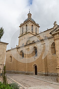 Lateral facade view at the iconic spanish Romanesque architecture building at the Cuidad Rodrigo cathedral, towers and domes, photo