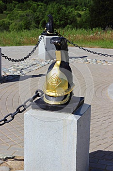 Cuirassier helmet on a plinth