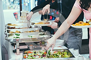 Cuisine Culinary Buffet Dinner Dining Food Celebration Party Concept. A group of people in all you can eat buffet