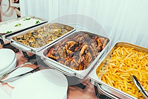 Cuisine Culinary Buffet Dinner Dining Food Celebration Party Concept. Trays with main meals - french fries chips, rice