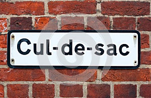 Cul-de-sac road sign on brick photo