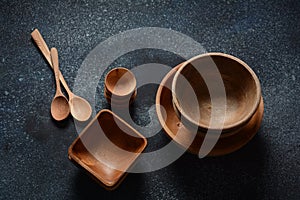 Culinary background : empty ceramic plates, wooden or bamboo spoons and bowls