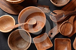 Culinary background, empty ceramic plates, wooden or bamboo spoons and bowls