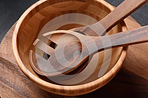 Culinary background, empty ceramic plates, wooden or bamboo spoons and bowls