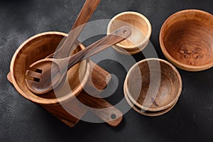 Culinary background, empty ceramic plates, wooden or bamboo spoons and bowls