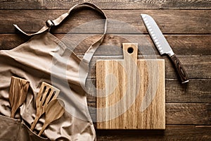 Culinary background, kitchen utensils and apron on kitchen countertop