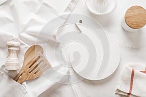 Culinary background, kitchen utensils and apron on kitchen countertop