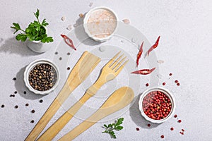 Culinary background with wooden kitchen utensil, spices and herbs. Set for preparation healthy food