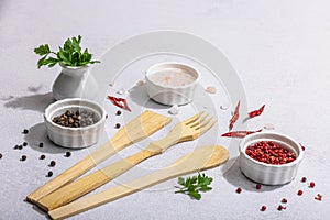 Culinary background with wooden kitchen utensil, spices and herbs. Set for preparation healthy food